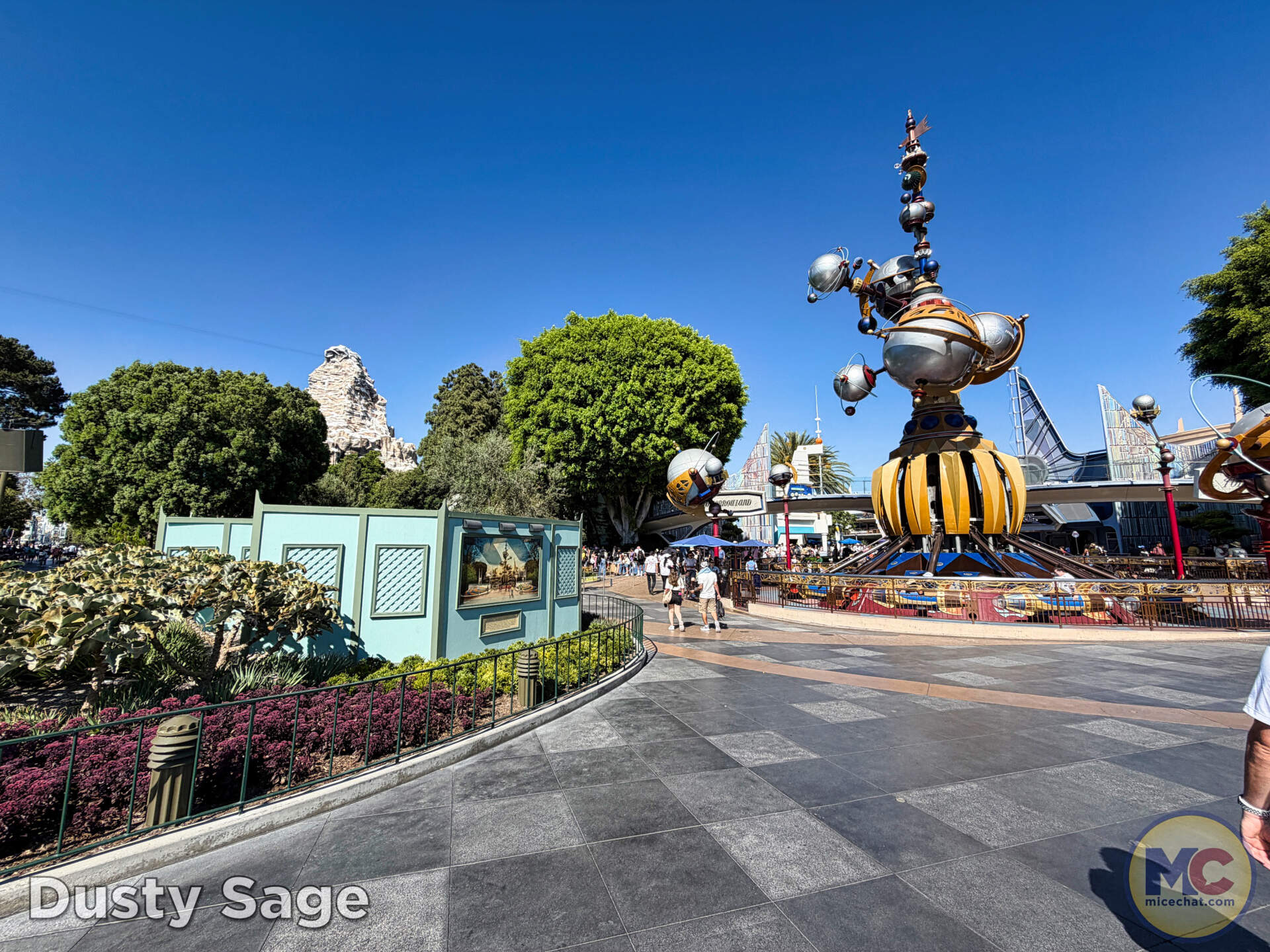 The unfinished construction wall at the Tomorrowland entrance