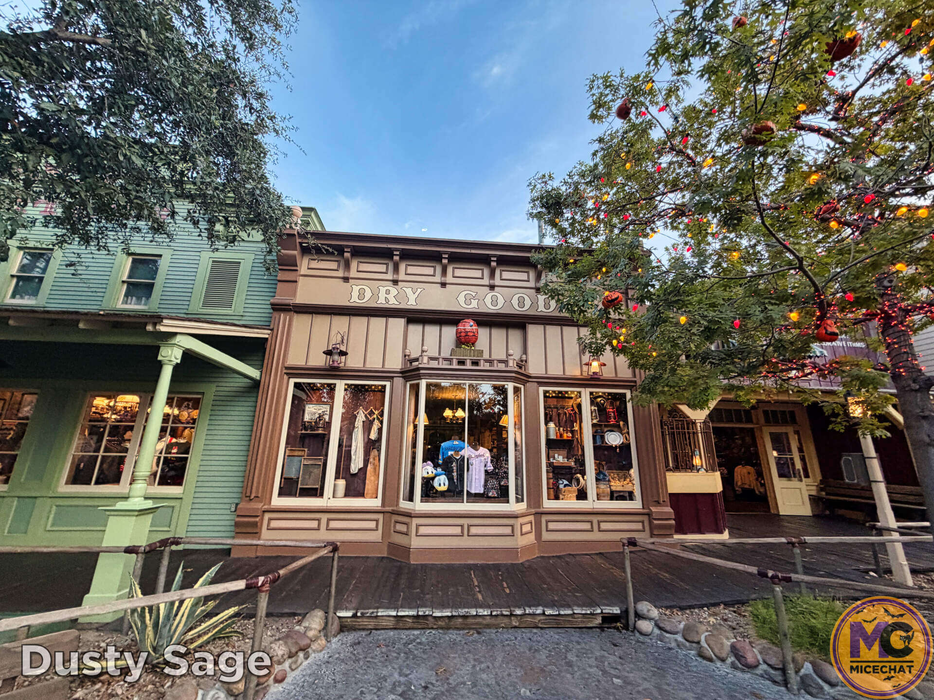 Frontierland storefronts decorated beside the Halloween Tree at Disneyland