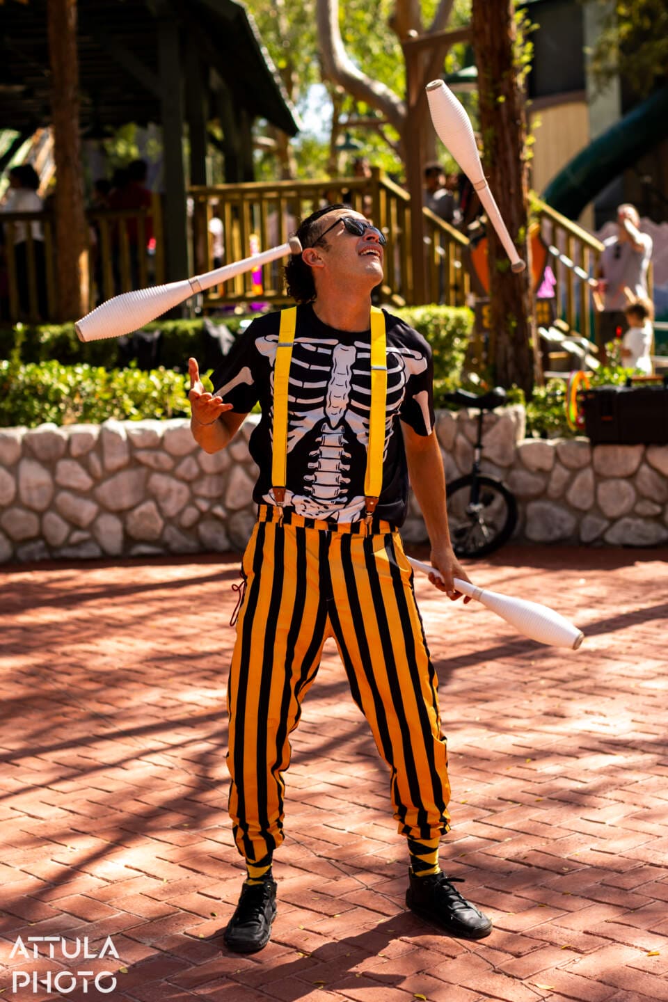 Tricksters carnival performers in Looney Tunes Land at Six Flags Magic Mountain Tricks and Treats 2026