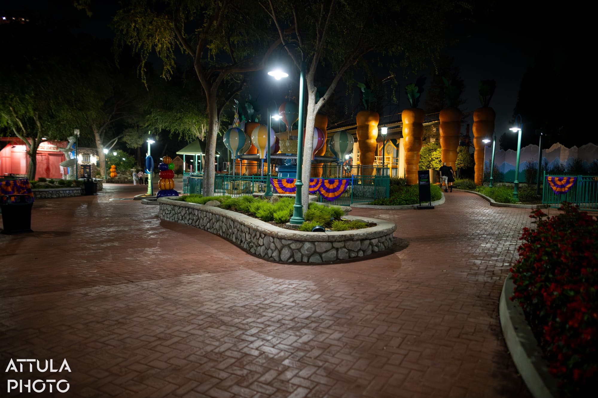 Path through Looney Tunes Land toward the Wolves' Blood maze entrance at Six Flags Magic Mountain