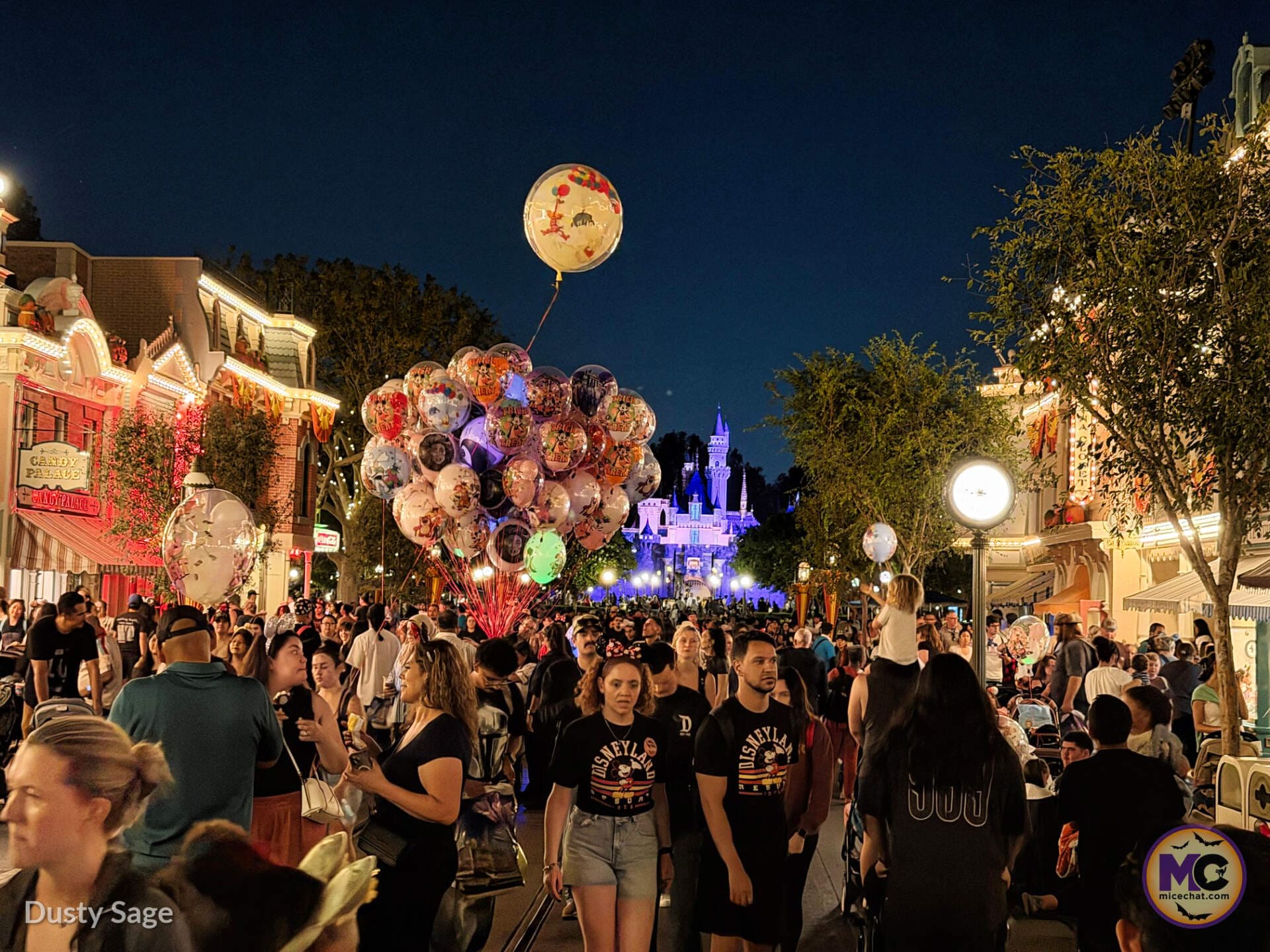 Halloween Time crowd on Main Street U.S.A. at night