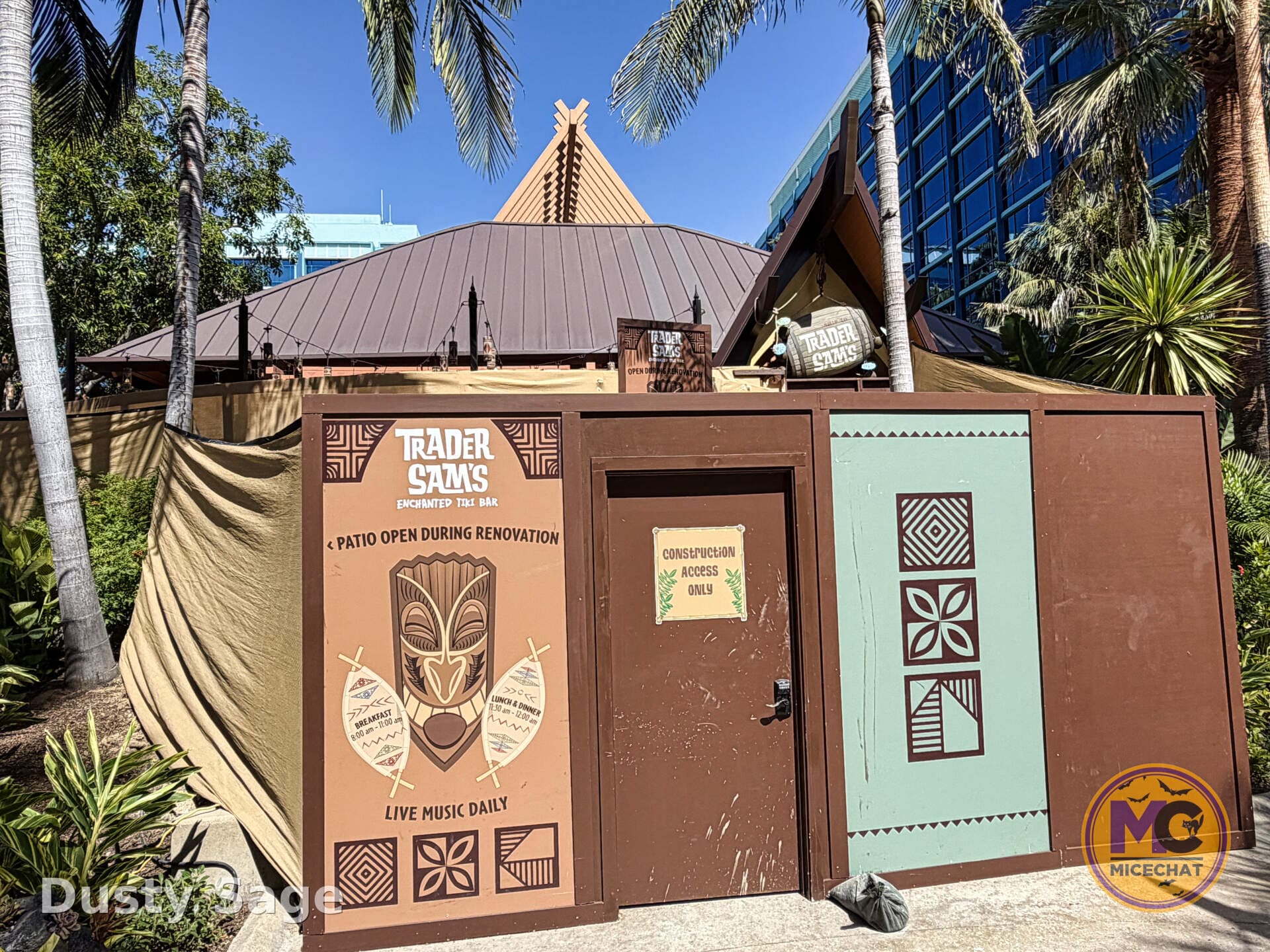 Construction walls around Trader Sam's Enchanted Tiki Bar during the tiki torch refurbishment
