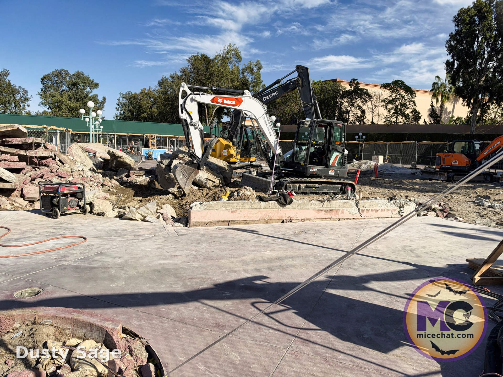 Heavy equipment clearing concrete on the east side of the esplanade